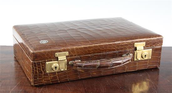 A small 1930s rectangular crocodile skin attache case, 14in.